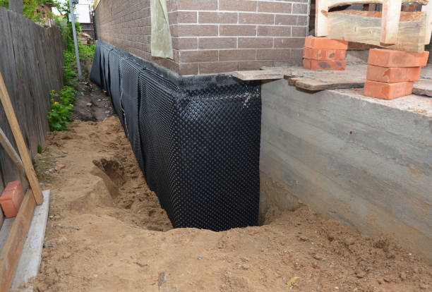Happy homeowners after waterproofing job in Colgate